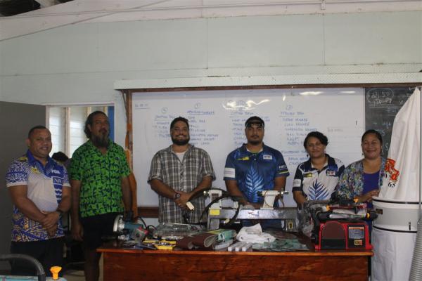 Waste Management Niue representatives with tools supplied for school technology classes